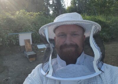 selfie of a man wearing bee protection clothing